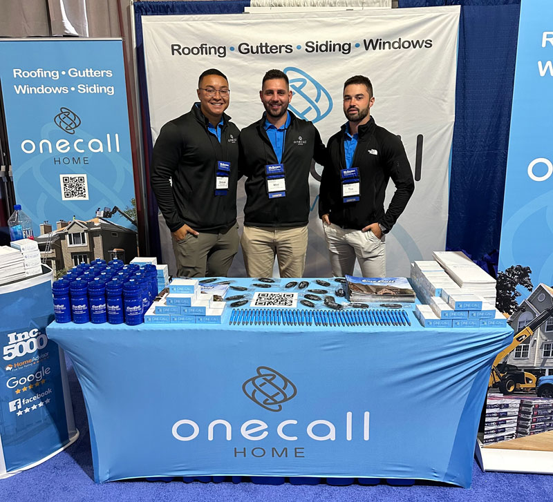 One Call staff at booth for event